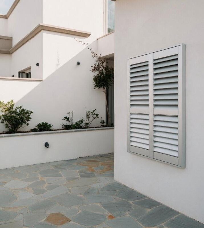 Aluminium shutters outdoor installation Melbourne — We Inspire Blinds